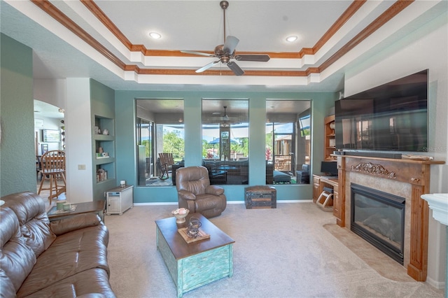 10177 Sunburst Ct, Spring Hill, FL 34608 - living room featuring plenty of natural light, a ceiling fan, a glass covered fireplace, and ornamental molding