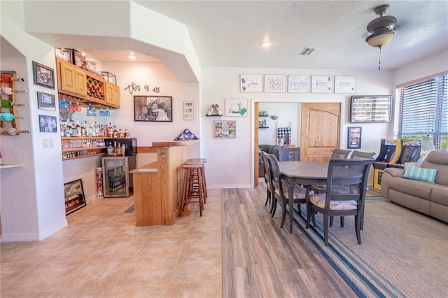 10177 Sunburst Ct, Spring Hill, FL 34608 - dining area featuring visible vents, a dry bar, baseboards, and recessed lighting