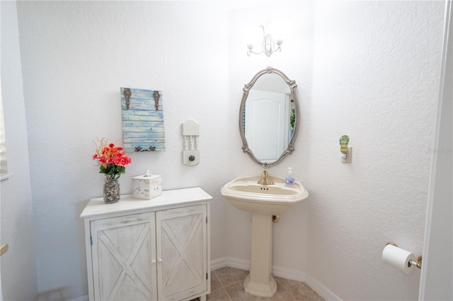 bathroom with tile patterned floors