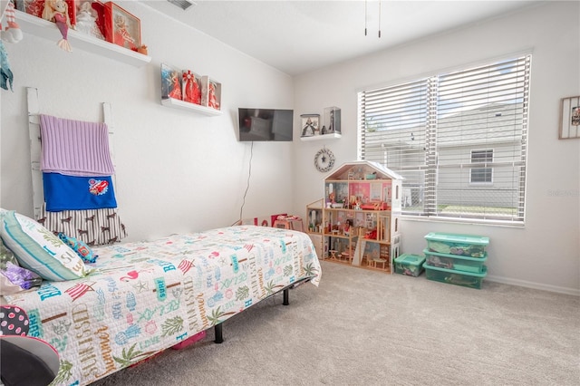 bedroom featuring carpet floors and multiple windows