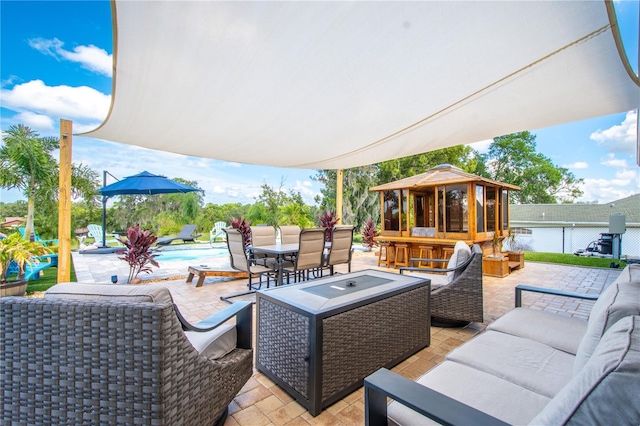 view of patio with a fenced in pool and outdoor lounge area