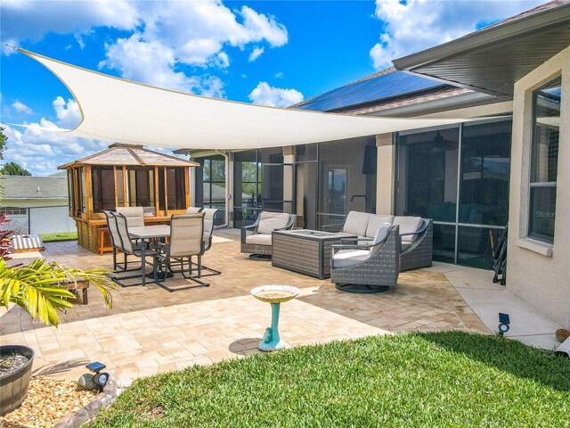 10177 Sunburst Ct, Spring Hill, FL 34608 - view of patio featuring an outdoor living space, outdoor dining space, a sunroom, and a gazebo
