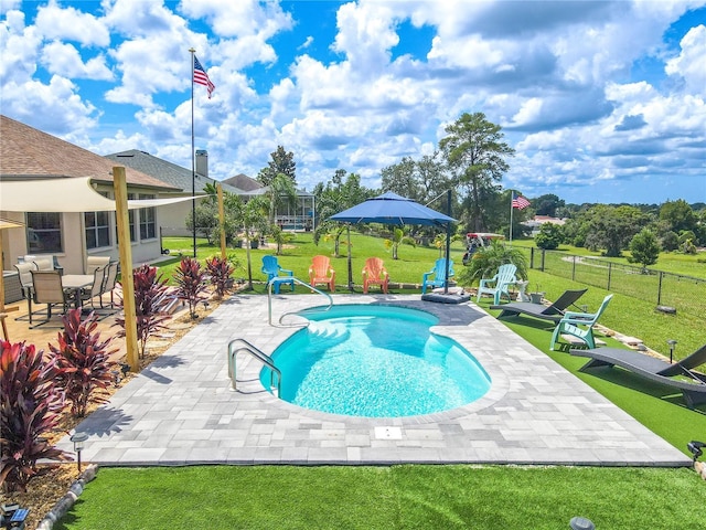 10177 Sunburst Ct, Spring Hill, FL 34608 - view of pool with a fenced in pool, a patio area, fence, and a yard
