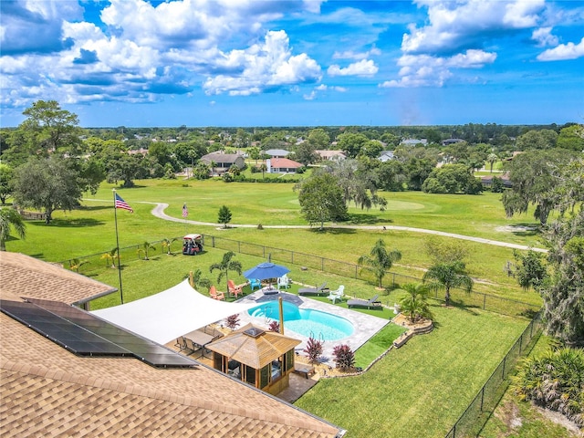 view of swimming pool with a lawn