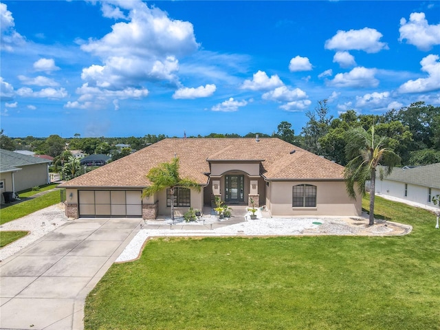 10177 Sunburst Ct, Spring Hill, FL 34608 - ranch-style house featuring driveway, roof with shingles, a front yard, a garage, and stucco siding
