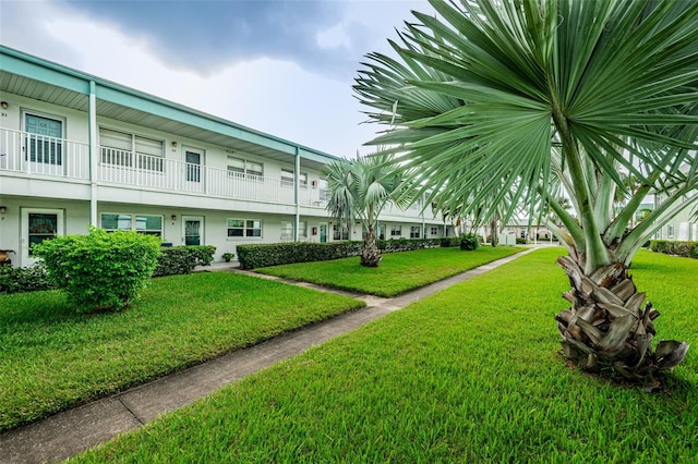 view of property's community with a yard