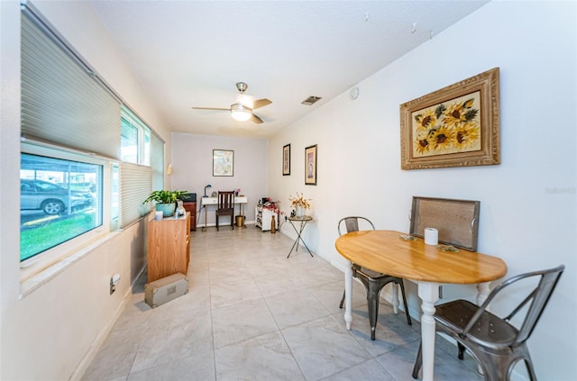 dining room featuring ceiling fan