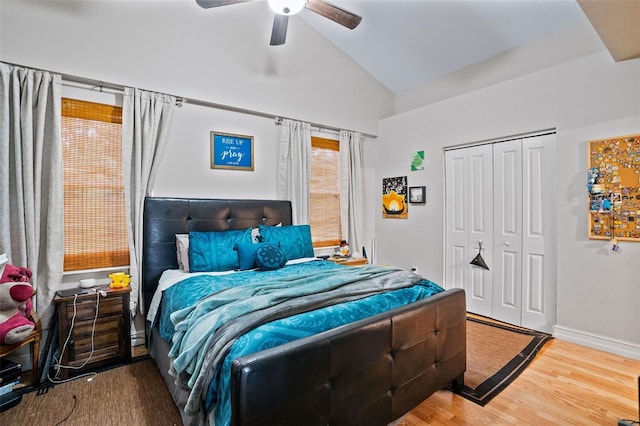 bedroom featuring vaulted ceiling, a closet, ceiling fan, and hardwood / wood-style flooring