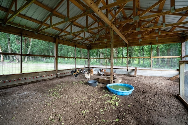 exterior space featuring vaulted ceiling