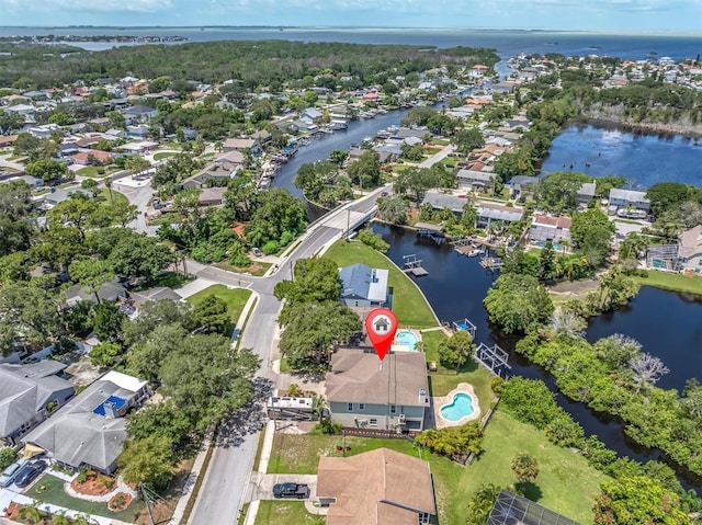 birds eye view of property with a water view and a residential view