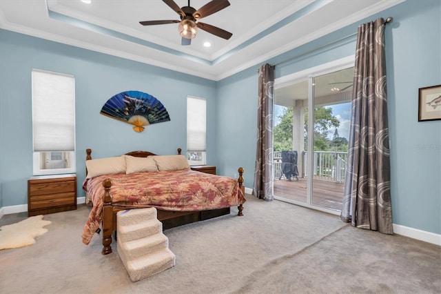 bedroom featuring ornamental molding, access to outside, a raised ceiling, and baseboards