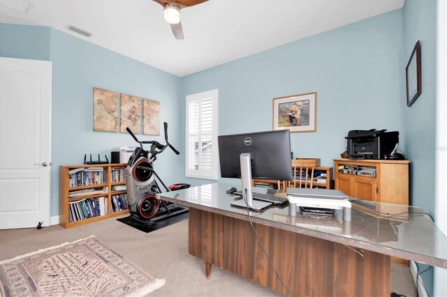 carpeted office space with visible vents and ceiling fan