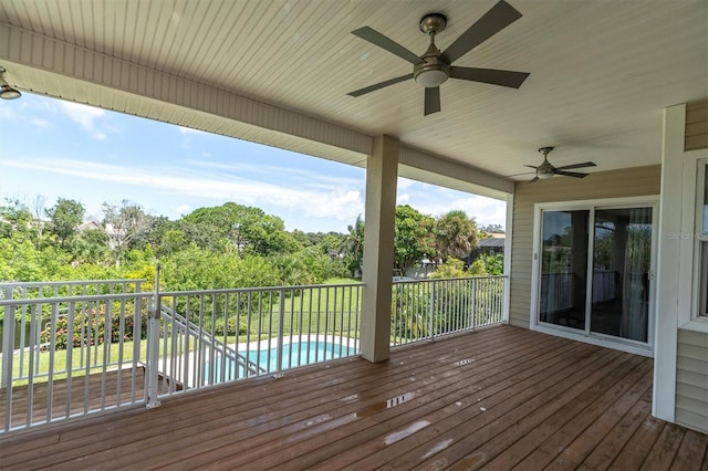 wooden deck with an outdoor pool and ceiling fan