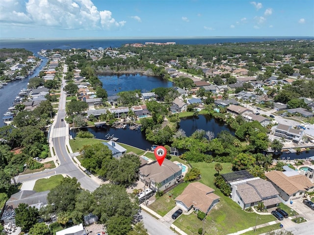 birds eye view of property with a residential view and a water view