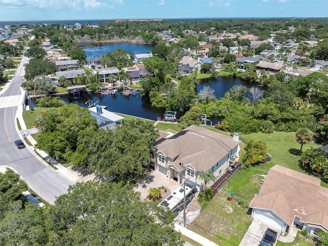 birds eye view of property featuring a water view and a residential view