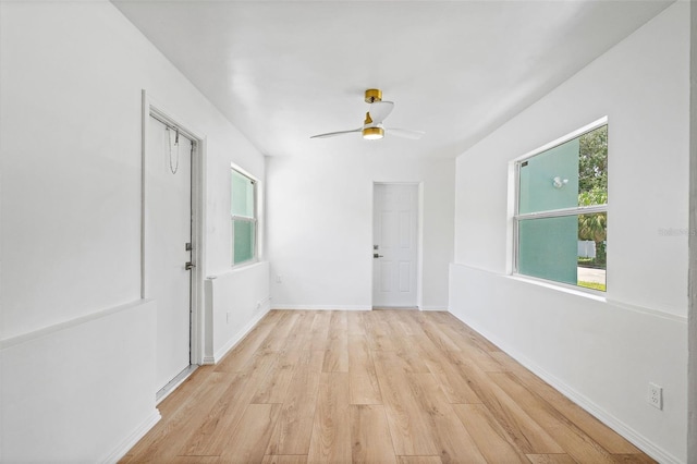 unfurnished room featuring ceiling fan and light wood-type flooring