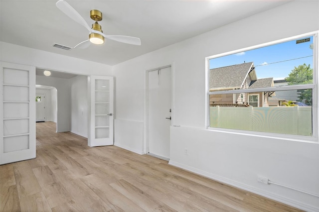 empty room featuring ceiling fan and light hardwood / wood-style flooring