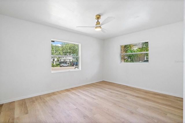 spare room with ceiling fan and light hardwood / wood-style floors