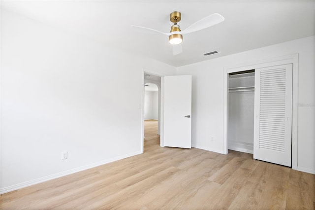 unfurnished bedroom featuring a closet, ceiling fan, and light hardwood / wood-style flooring