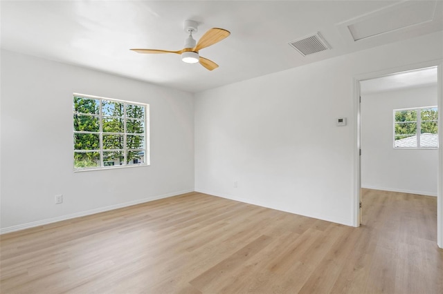 unfurnished room with ceiling fan and light hardwood / wood-style floors