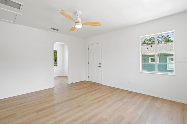 unfurnished room with ceiling fan and light wood-type flooring