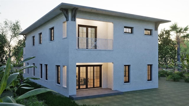 1045 Conant Ave, Safety Harbor, FL 34695 - rear view of property with a patio area, french doors, a balcony, and stucco siding