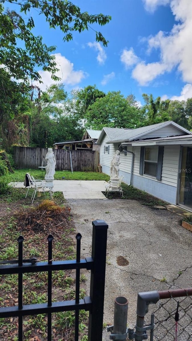 view of yard featuring a fenced front yard and a patio area