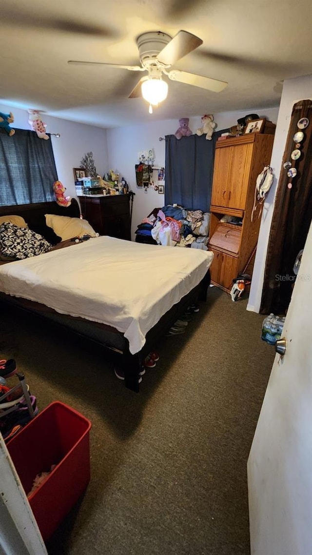 carpeted bedroom with a ceiling fan