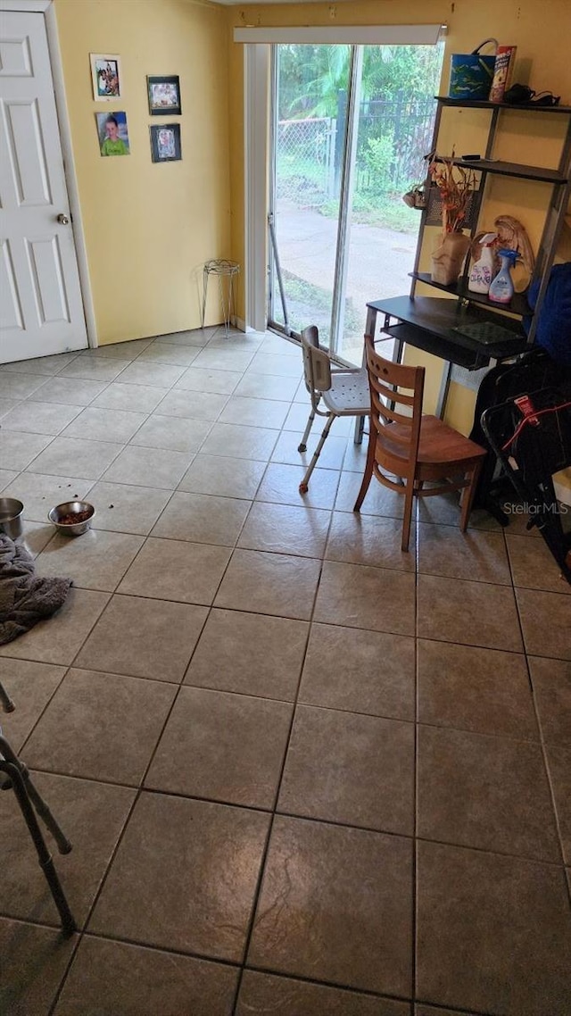 dining area with tile patterned flooring