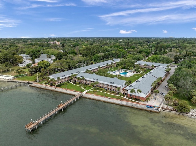 aerial view with a water view and a view of trees