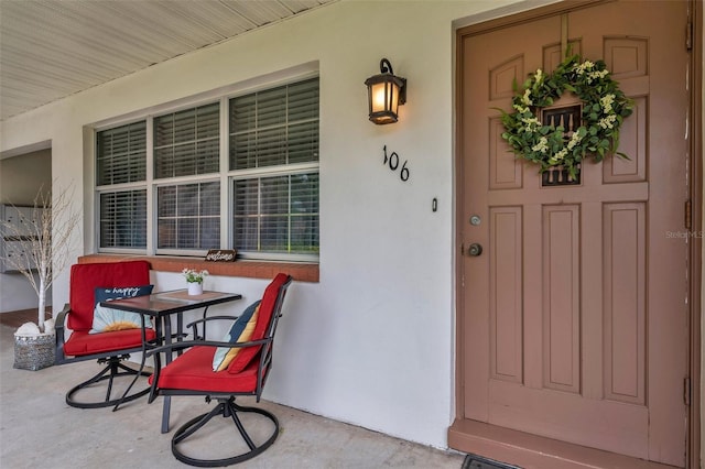 doorway to property with a porch