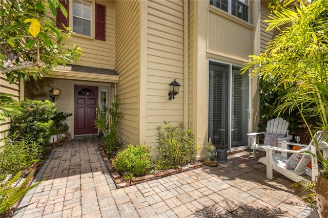 property entrance featuring a patio area