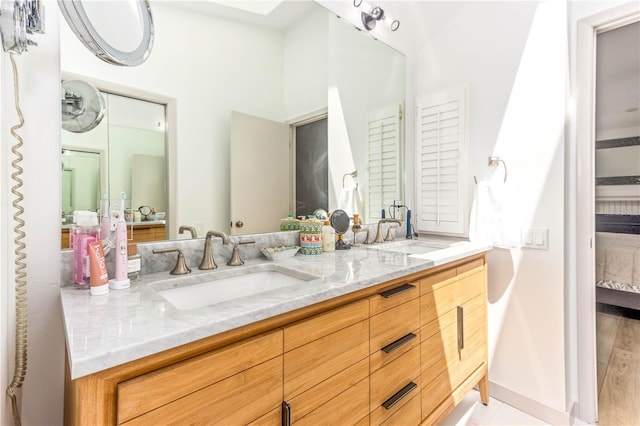 bathroom featuring vanity and wood-type flooring