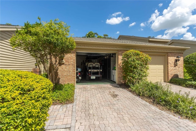 view of exterior entry with a garage