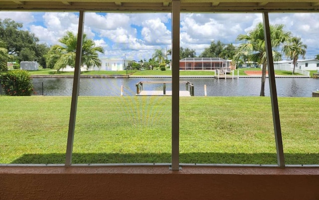 unfurnished sunroom with a water view