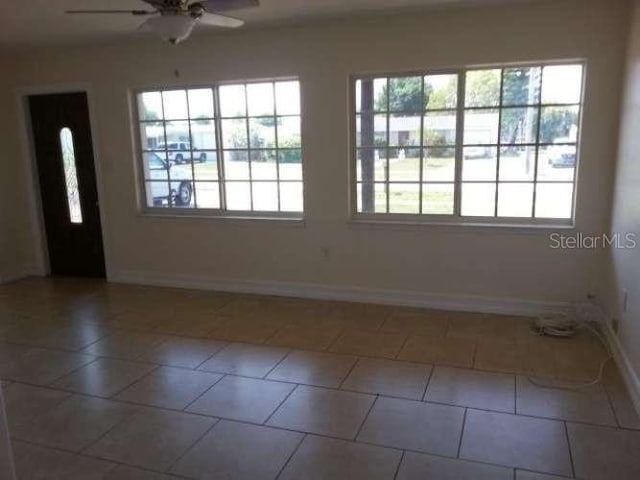 interior space featuring ceiling fan