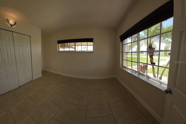 spare room with tile patterned flooring and a healthy amount of sunlight