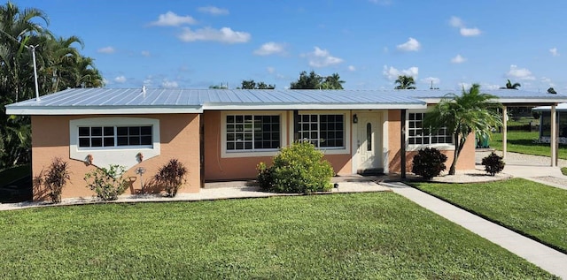 ranch-style house with a front lawn