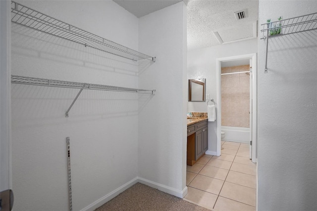 200 Country Club Dr Unit 1004, Largo, FL 33771 - walk in closet featuring light tile patterned flooring and visible vents