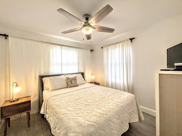 bedroom featuring dark wood-type flooring and ceiling fan