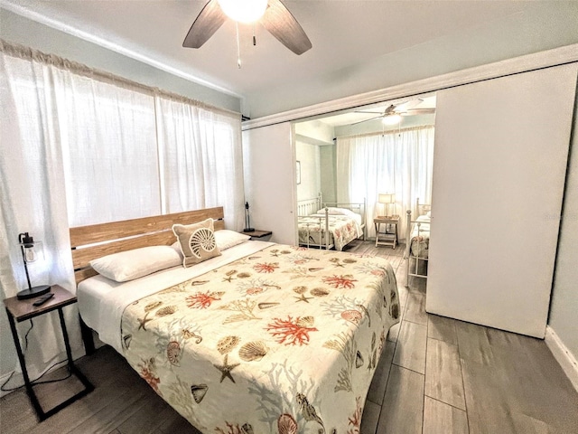 bedroom featuring ceiling fan, a closet, and light wood-type flooring