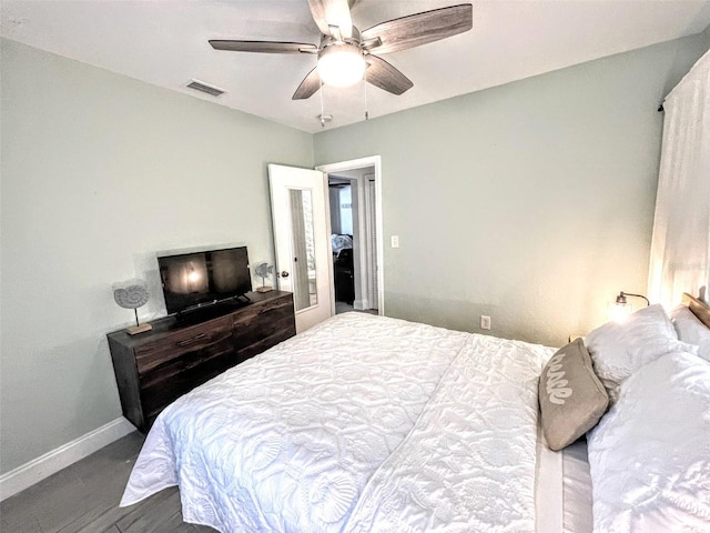 bedroom featuring ceiling fan and dark hardwood / wood-style flooring