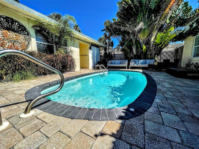 view of pool featuring a patio area