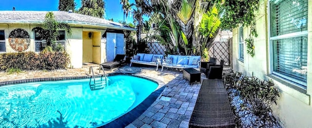 view of pool featuring an outdoor living space and a patio