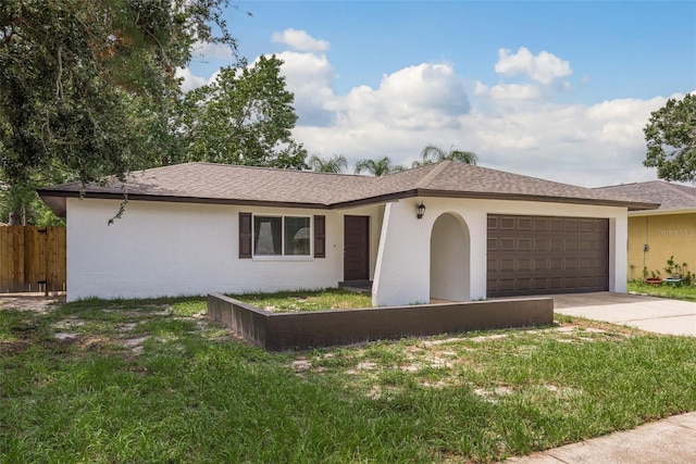 ranch-style house with a garage and a front lawn