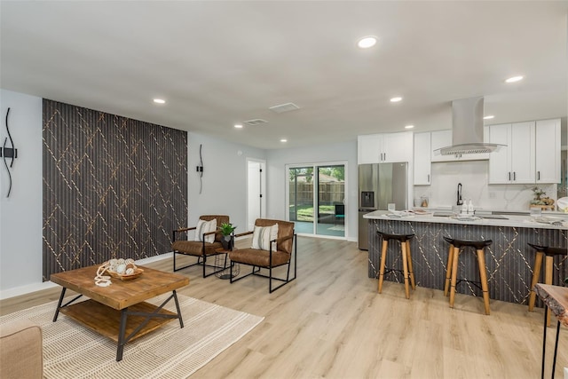 living room with light hardwood / wood-style flooring