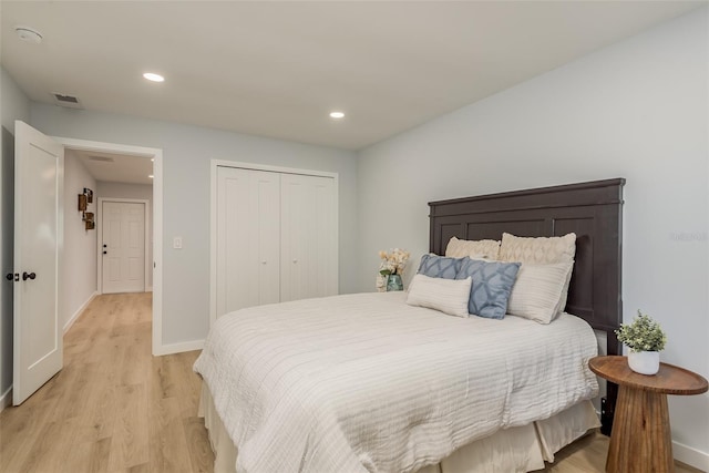 bedroom with a closet and light wood-type flooring