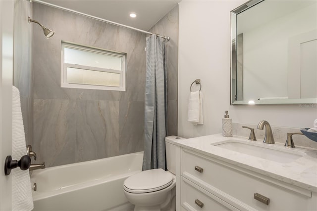 full bathroom with vanity, toilet, and shower / bath combination with curtain