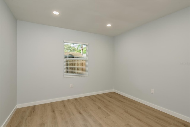 spare room featuring light wood-type flooring