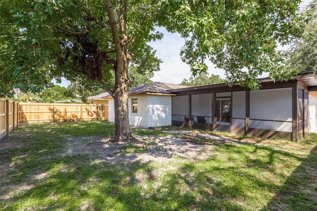 view of yard with a sunroom